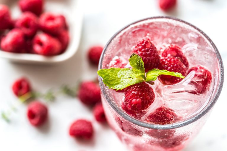 pexels photo water topped with raspberries